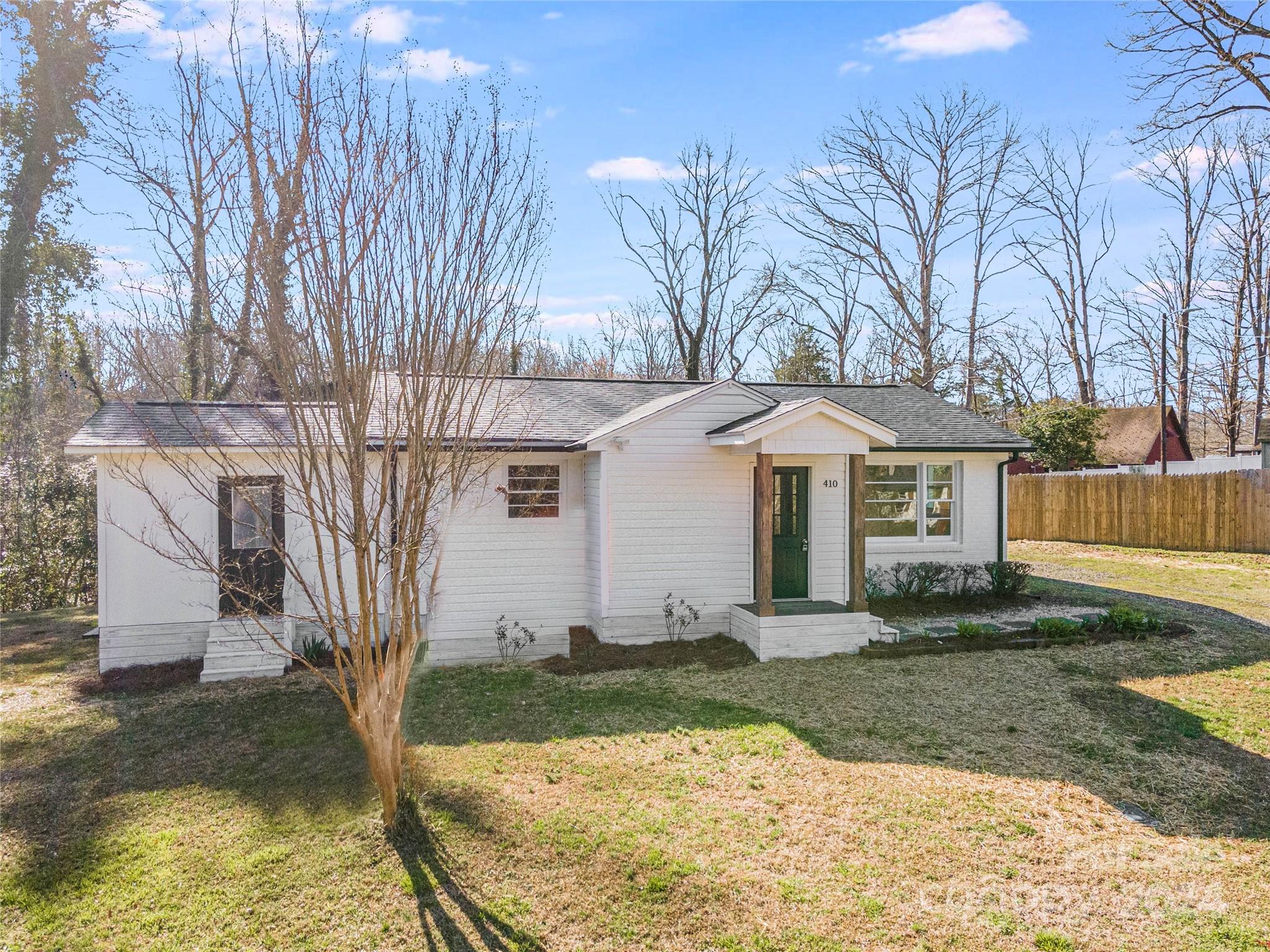 410 Holly Hills Road Dallas, NC 28034 - Photo 23 of 27 a front view of a house with garden