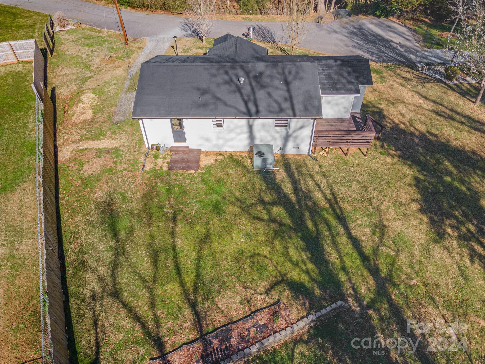 410 Holly Hills Road Dallas, NC 28034 - Photo 26 of 27 a view of residential houses with tree