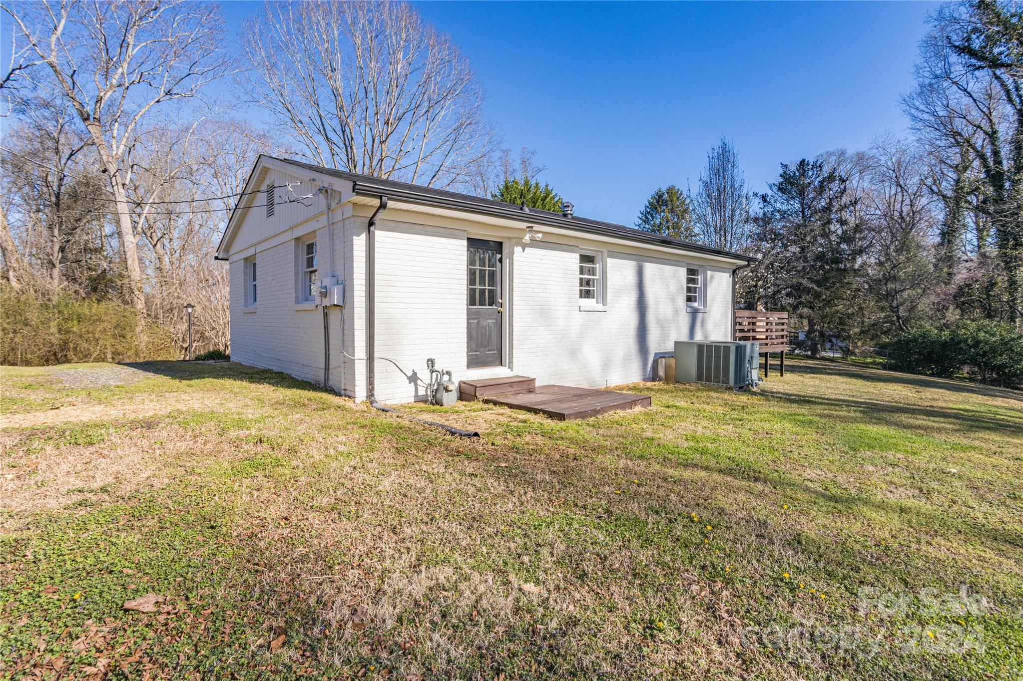410 Holly Hills Road Dallas, NC 28034 - Photo 3 of 27 a view of a house with backyard and tree