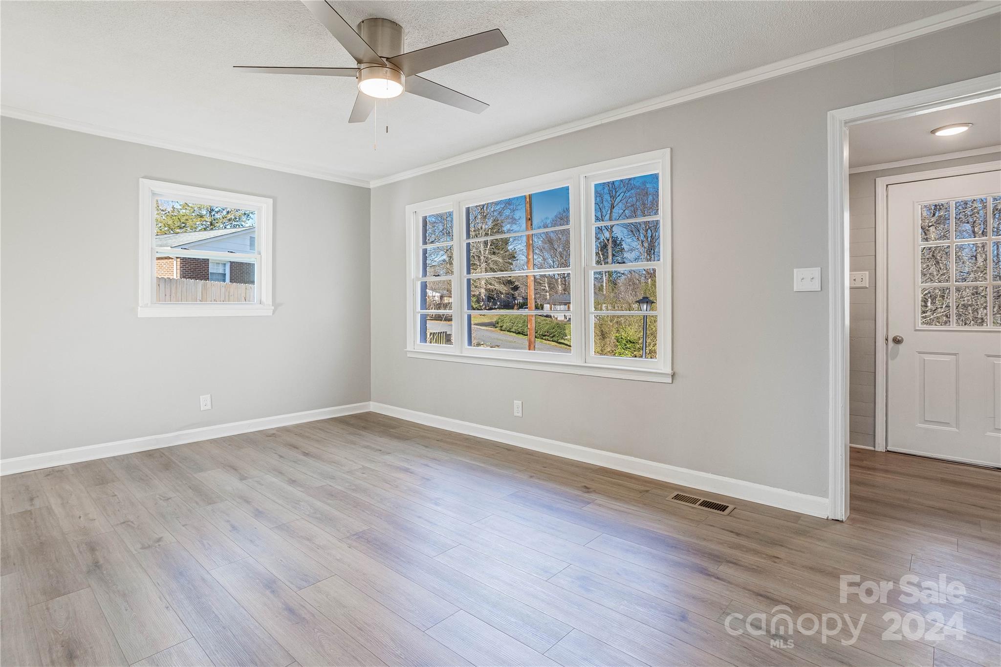 410 Holly Hills Road Dallas, NC 28034 - Photo 5 of 27 wooden floor in an empty room with a window