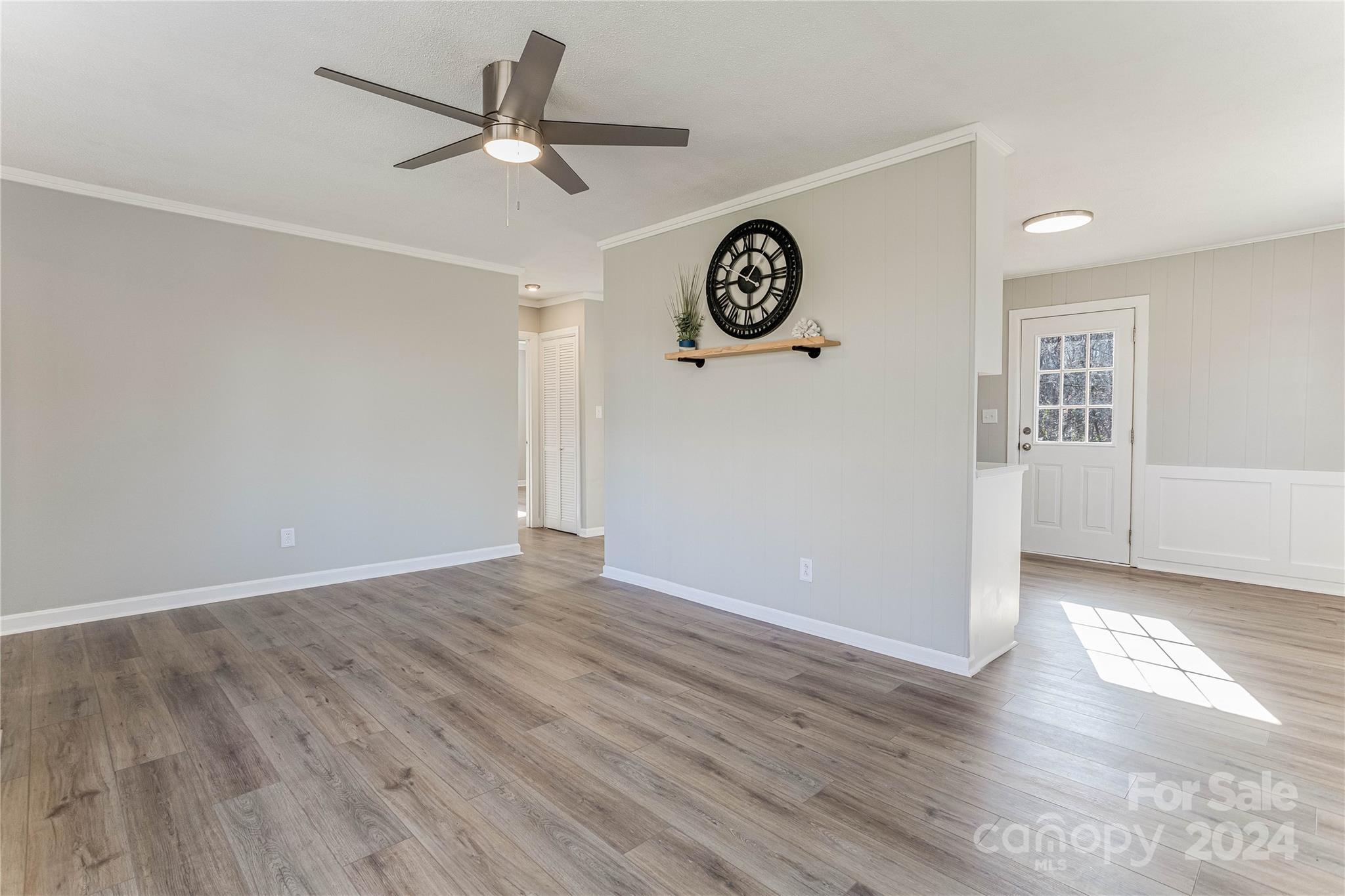 410 Holly Hills Road Dallas, NC 28034 - Photo 6 of 27 an empty room with wooden floor and windows