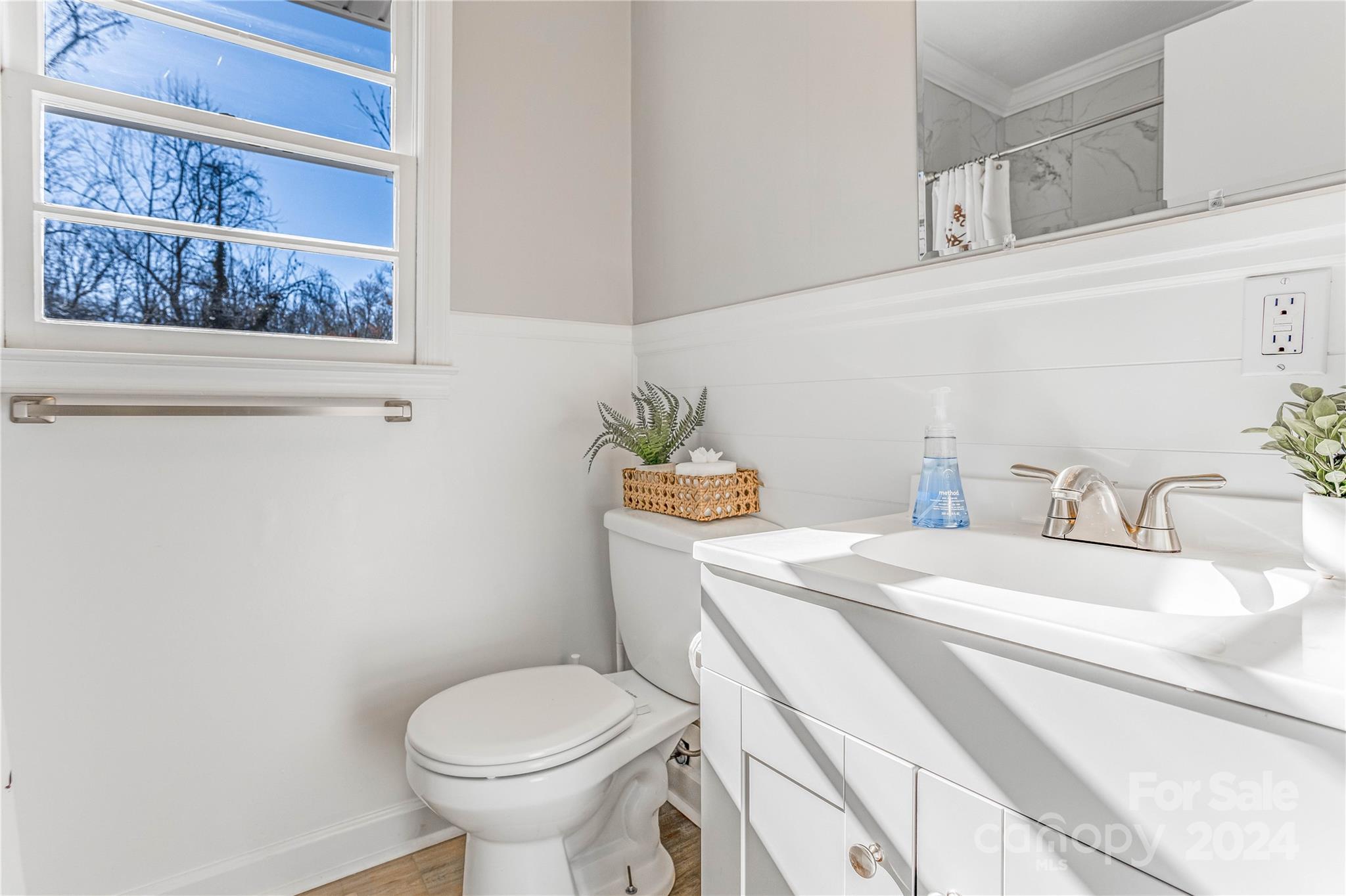 410 Holly Hills Road Dallas, NC 28034 - Photo 9 of 27 a bathroom with a granite countertop toilet sink and mirror
