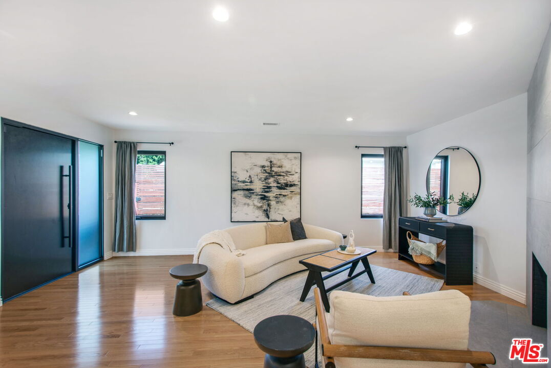 3558 Muirfield Road South Los Angeles, CA 90016 - Photo 22 of 23 a living room with furniture and a fireplace