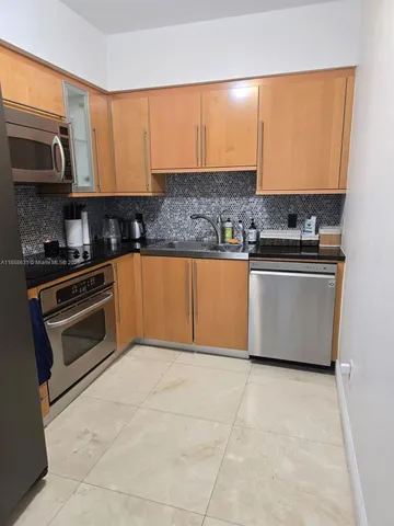 a close view of a stove top oven sitting inside of a kitchen