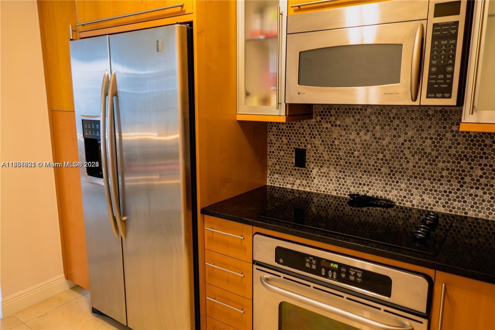 6365 Collins Avenue, Unit 2710 Miami Beach, FL 33141 - Photo 16 of 24 a close view of a stove top oven sitting inside of a kitchen