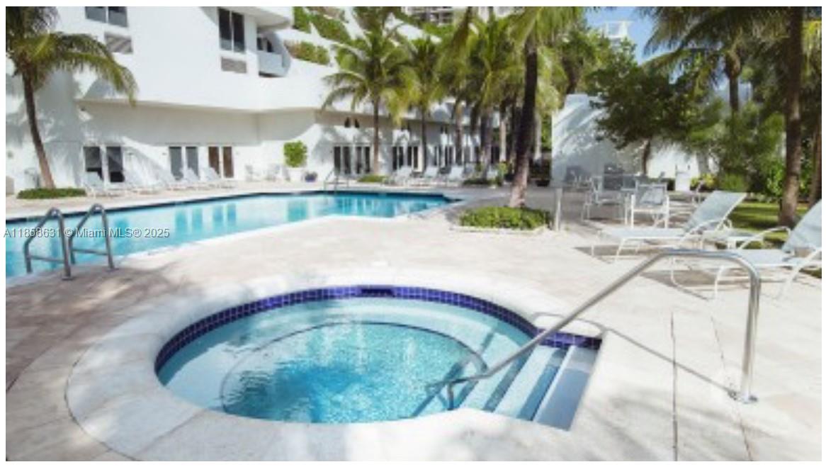 6365 Collins Avenue, Unit 2710 Miami Beach, FL 33141 - Photo 21 of 24 a view of swimming pool with outdoor seating