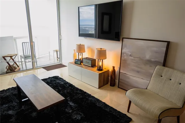 a living room with furniture and a lamp