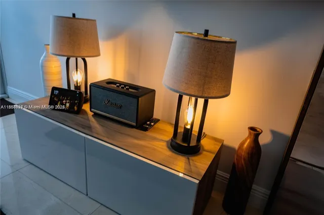 a living room with chair and a flat screen tv