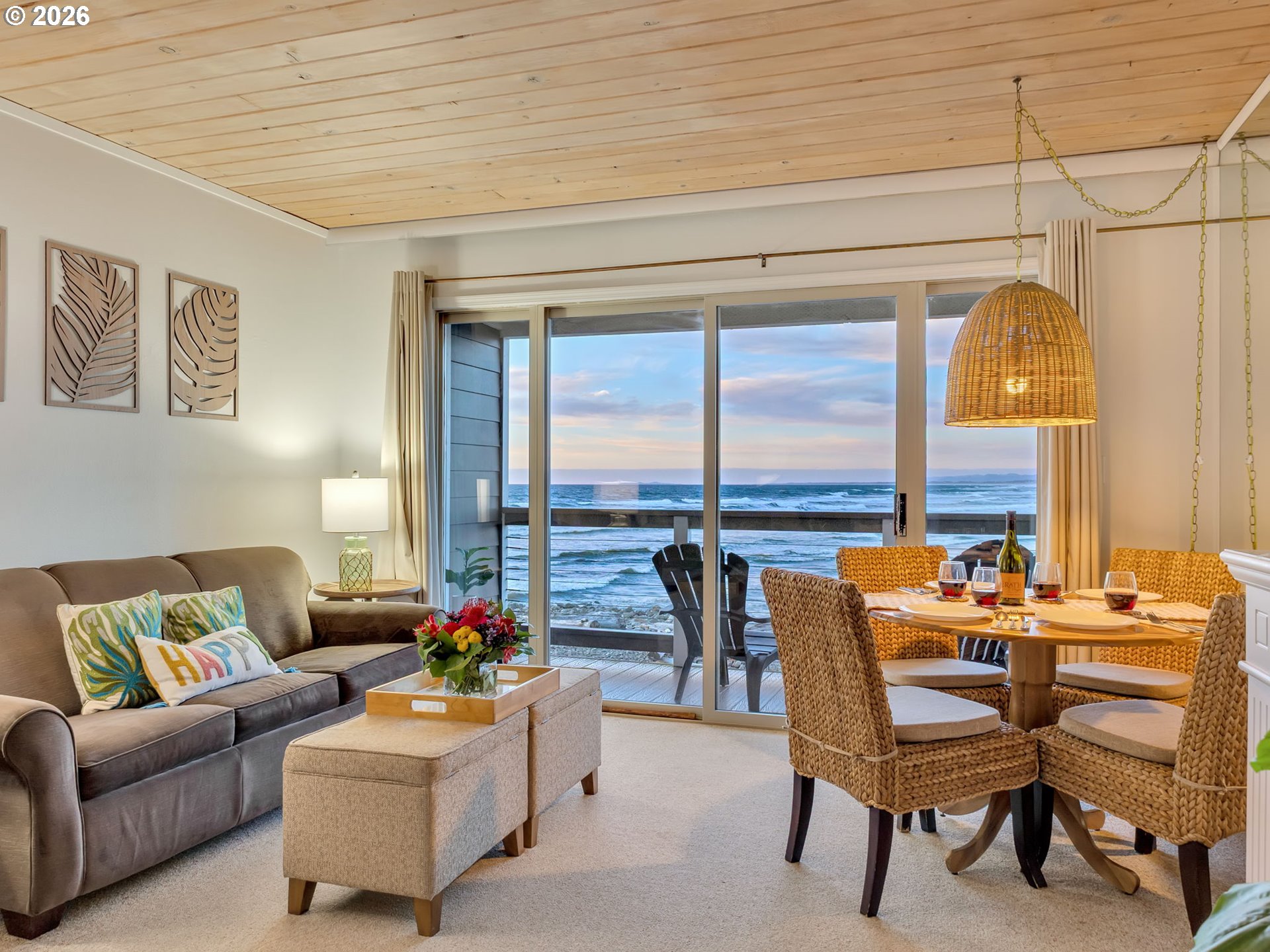 3140 Sunset Boulevard, Unit 36 Seaside, OR 97138 - Photo 14 of 41 a living room with furniture and a floor to ceiling window