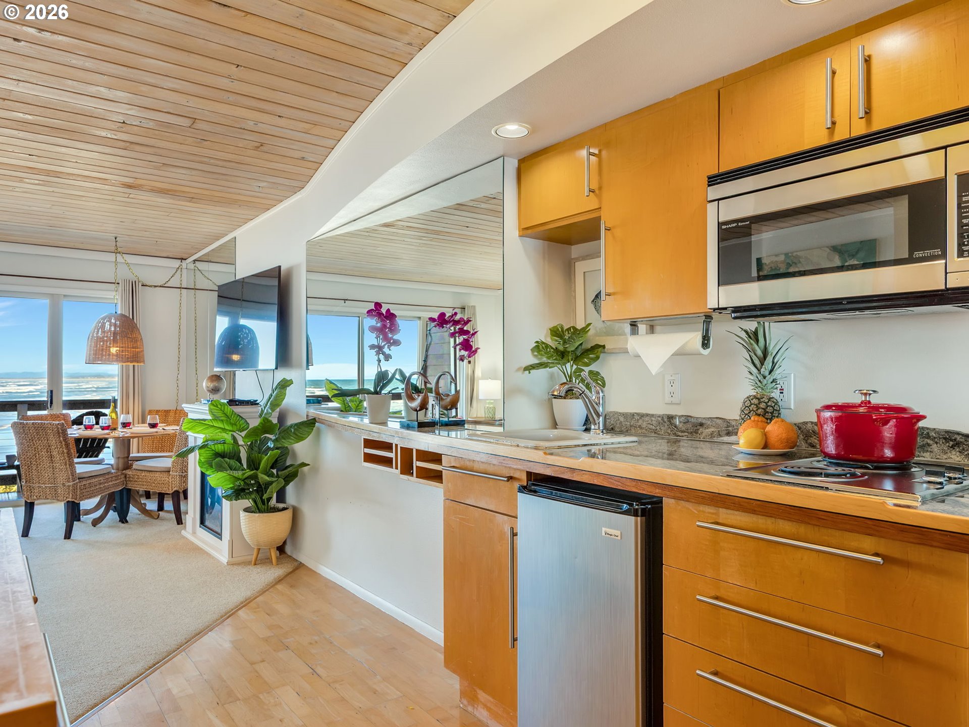 3140 Sunset Boulevard, Unit 36 Seaside, OR 97138 - Photo 21 of 41 a kitchen with a sink cabinets and wooden floor
