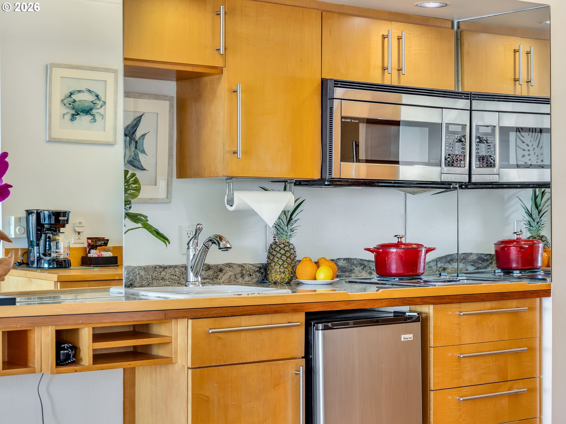 3140 Sunset Boulevard, Unit 36 Seaside, OR 97138 - Photo 23 of 41 a kitchen with a sink a stove and cabinets