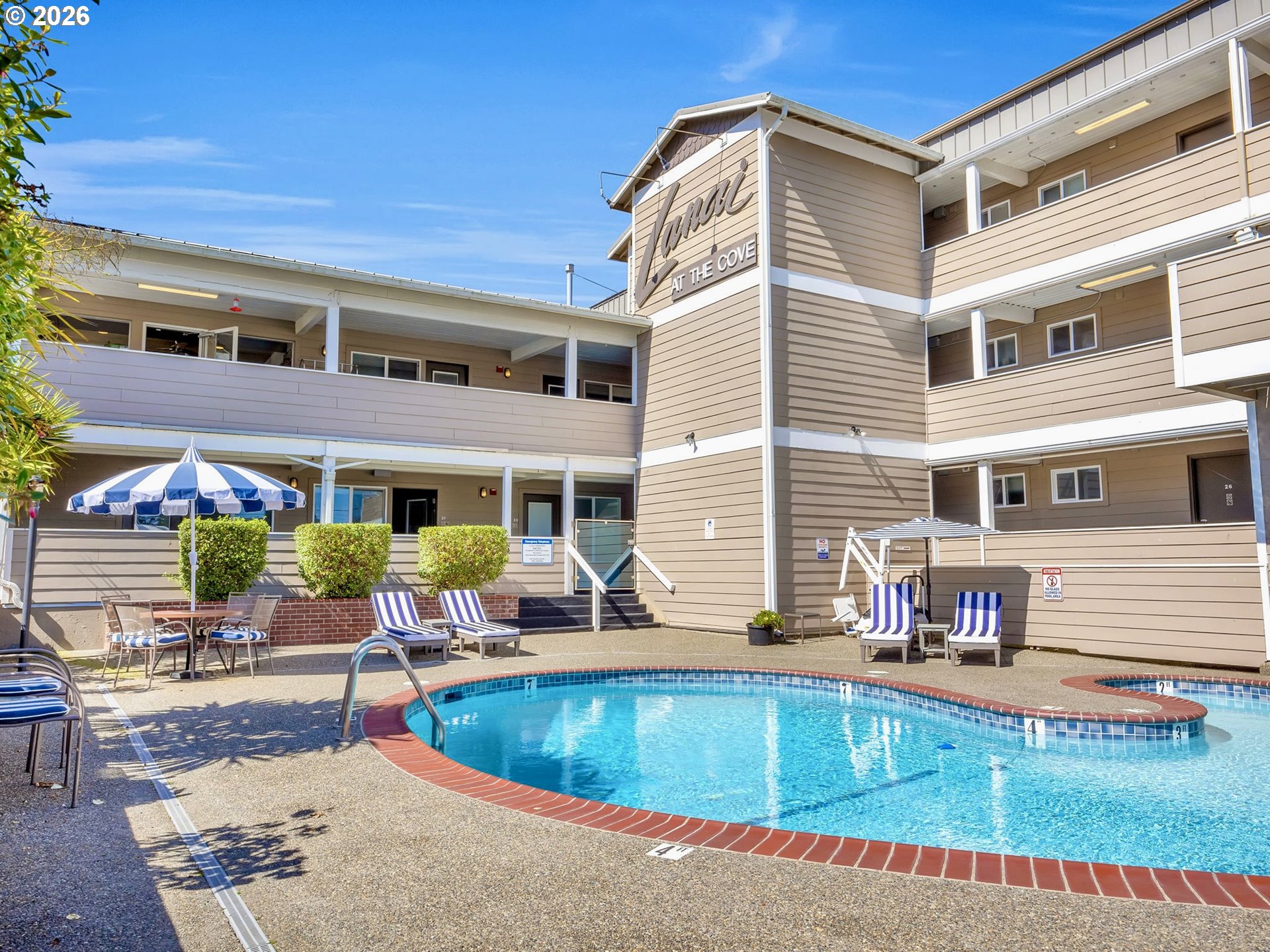 3140 Sunset Boulevard, Unit 36 Seaside, OR 97138 - Photo 27 of 41 a view of a house with pool and chairs