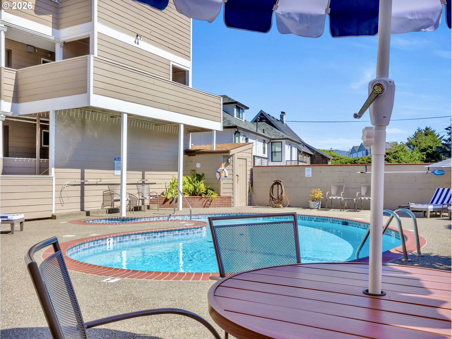 3140 Sunset Boulevard, Unit 36 Seaside, OR 97138 - Photo 28 of 41 a view of a chairs and table in the patio