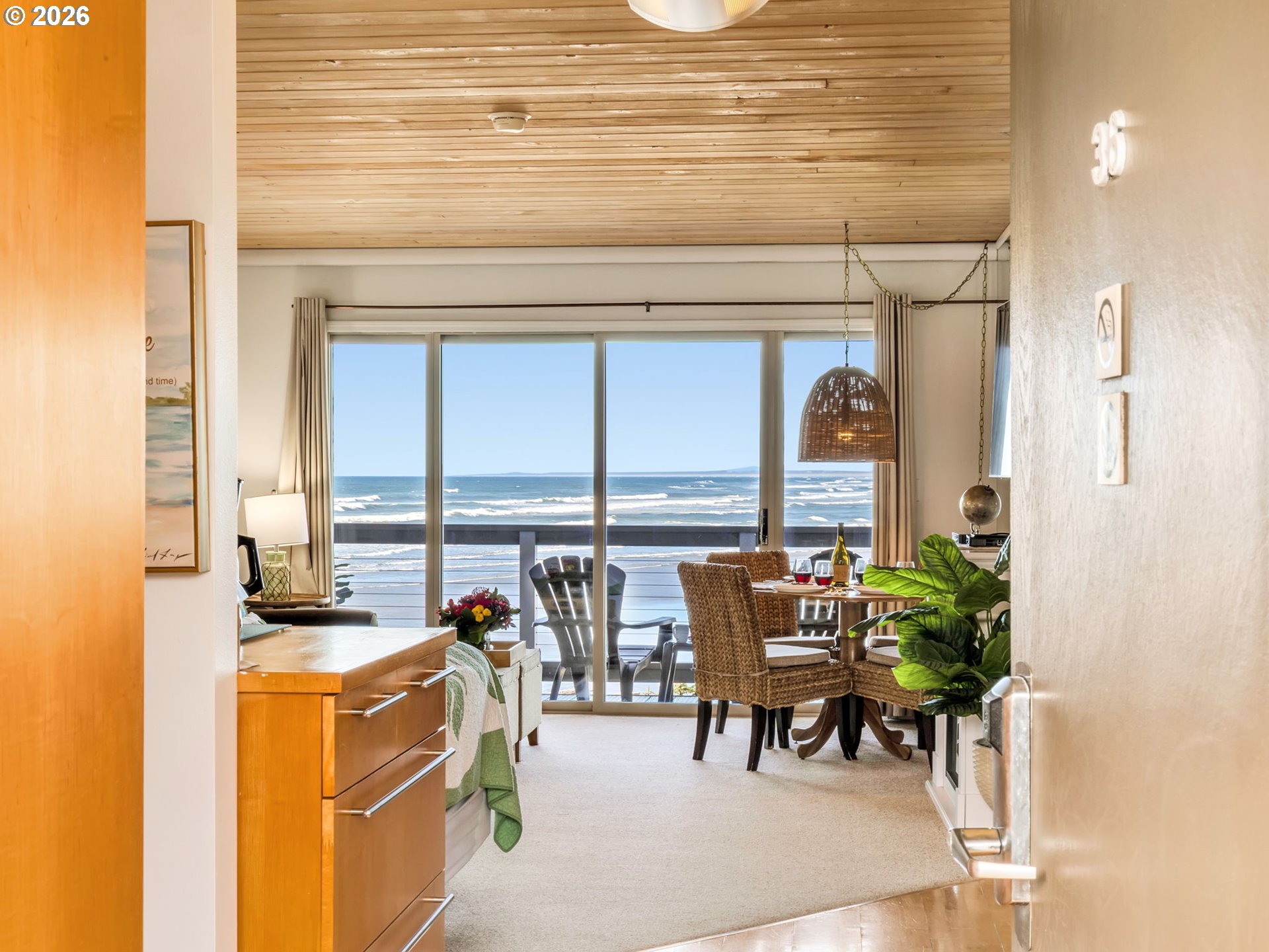 3140 Sunset Boulevard, Unit 36 Seaside, OR 97138 - Photo 3 of 41 a dining room with furniture and a floor to ceiling window