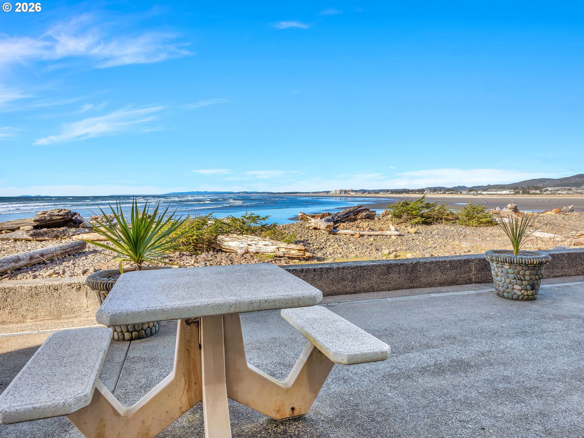 3140 Sunset Boulevard, Unit 36 Seaside, OR 97138 - Photo 31 of 41 a view of a chairs and table on the terrace