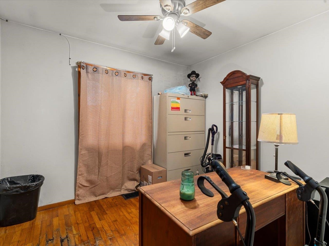520 South 6th Street Herrin, IL 62948 - Photo 12 of 14 a bedroom with a bed and a chandelier