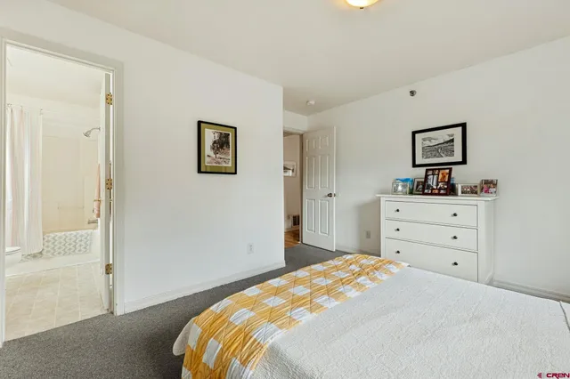 a bedroom with a bed and a cabinets