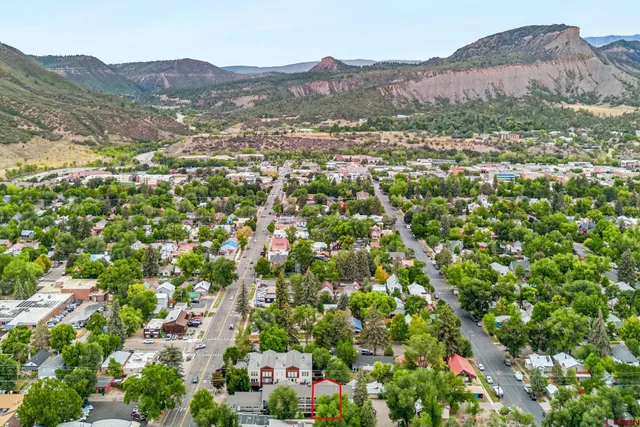 a view of a town with mountains in the background
