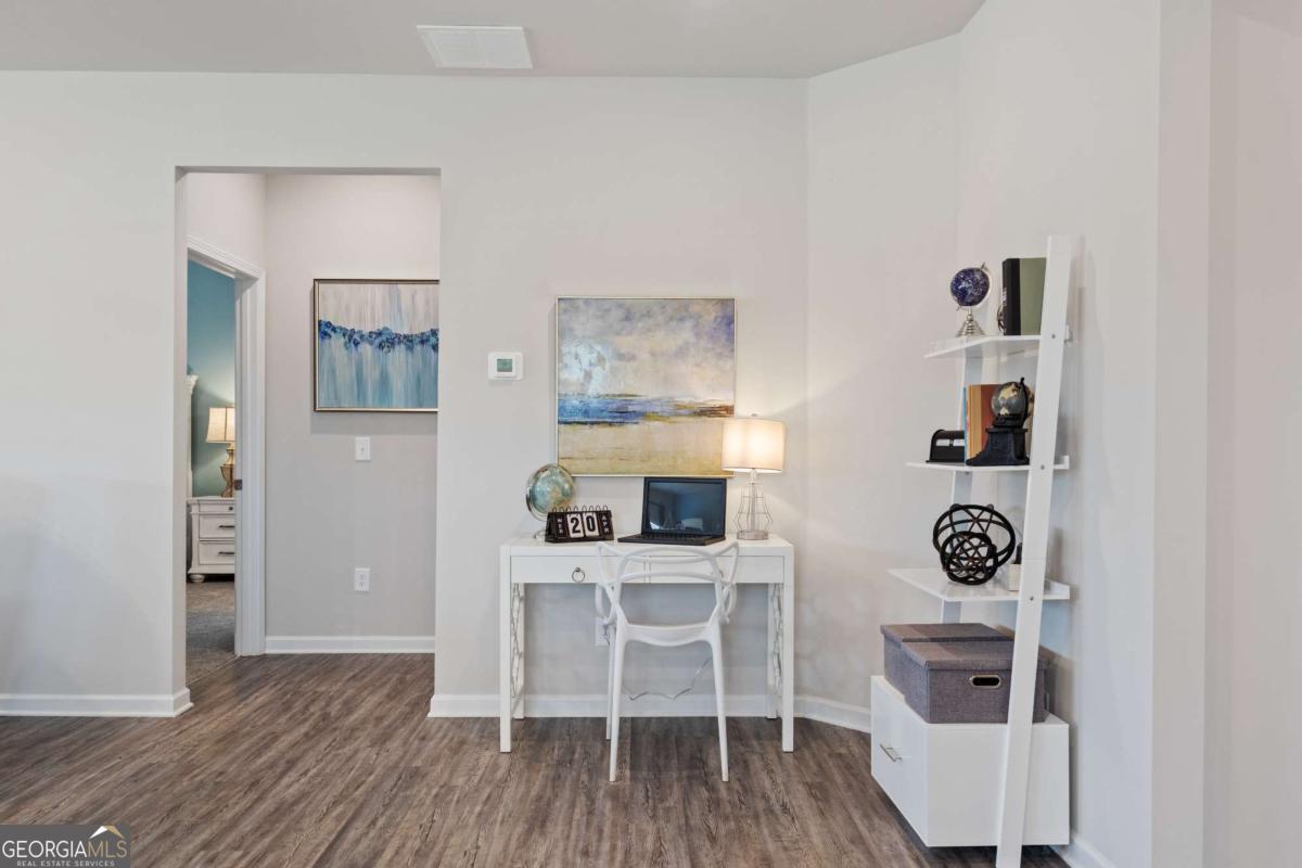 157 Creekside Road, Unit (LOT 32) Eatonton, GA 31024 - Photo 17 of 28 a view of a workspace with furniture and wooden floor