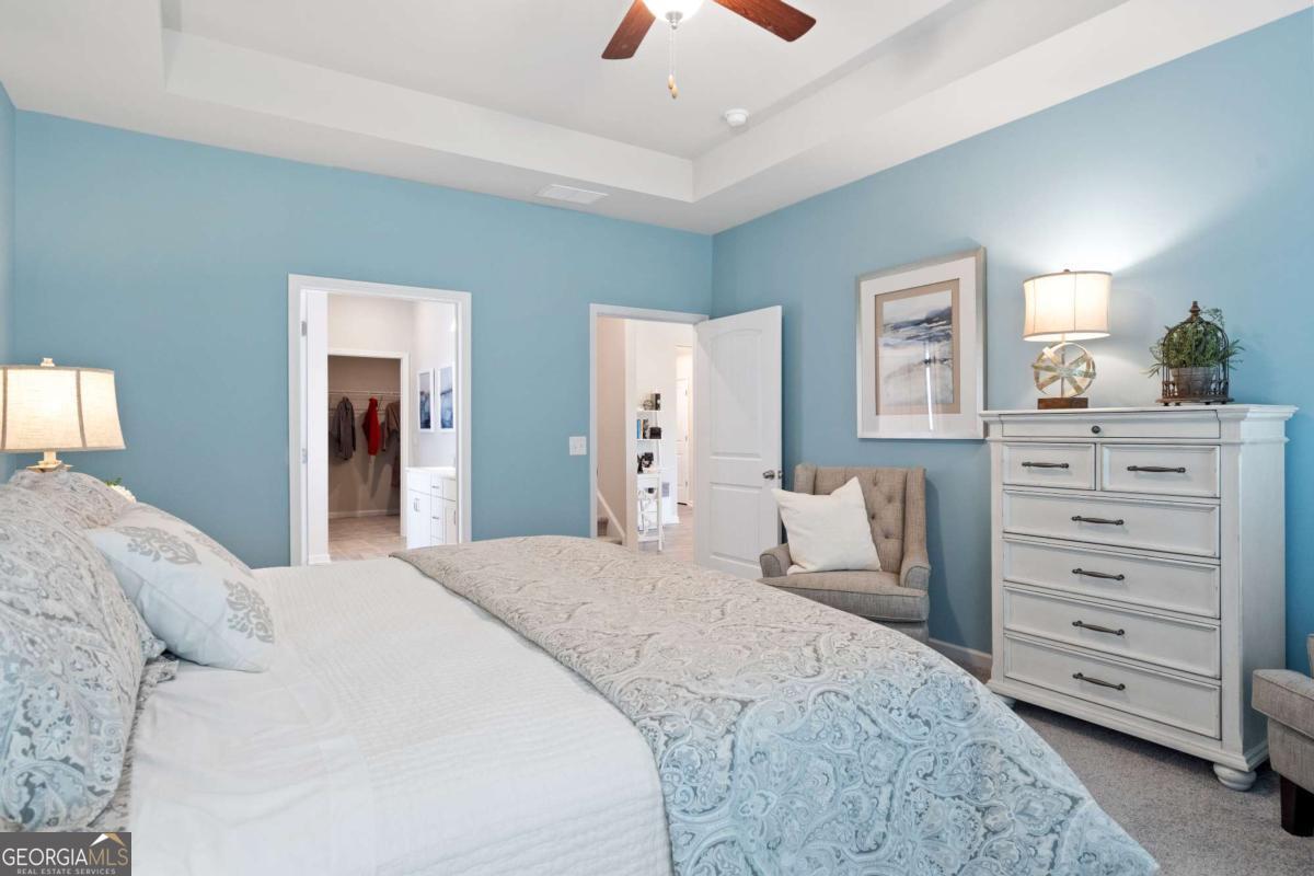 157 Creekside Road, Unit (LOT 32) Eatonton, GA 31024 - Photo 20 of 28 a bedroom with a bed and a dresser