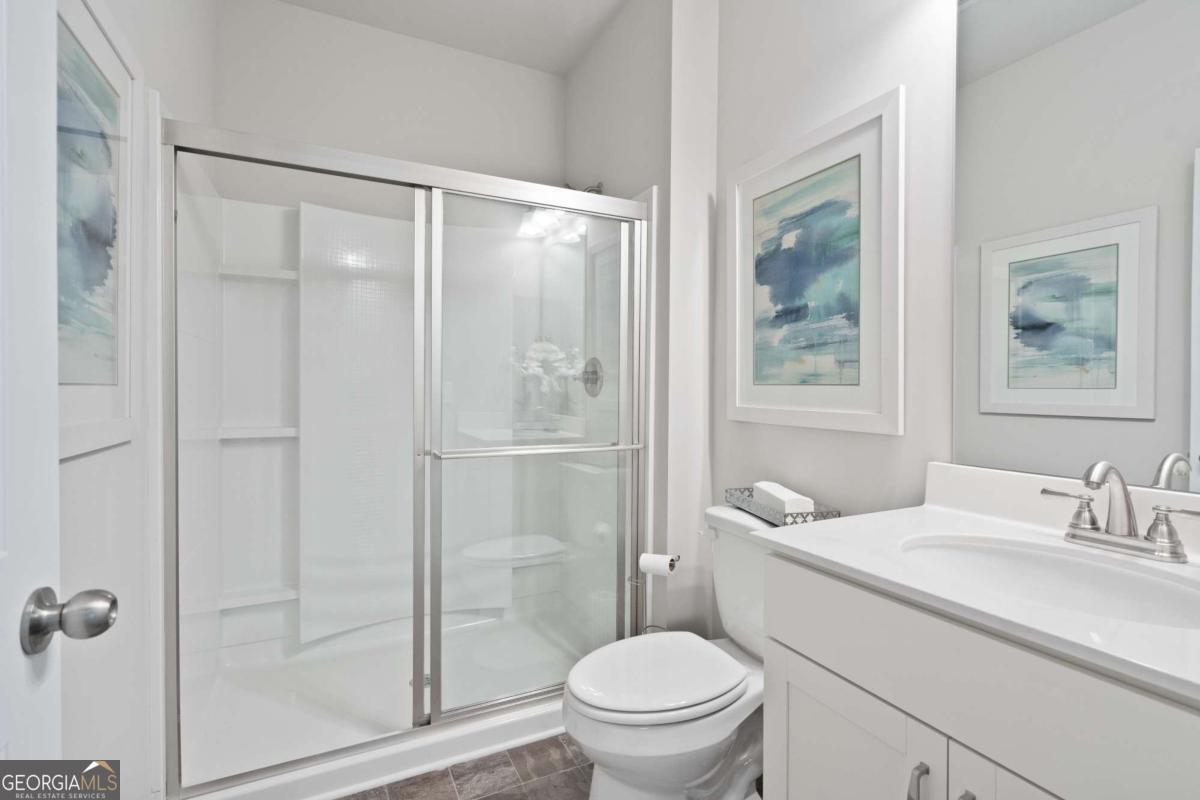 157 Creekside Road, Unit (LOT 32) Eatonton, GA 31024 - Photo 28 of 28 a bathroom with a granite countertop sink toilet and shower