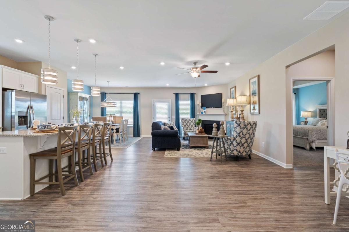 157 Creekside Road, Unit (LOT 32) Eatonton, GA 31024 - Photo 8 of 28 a living room with furniture and a fireplace