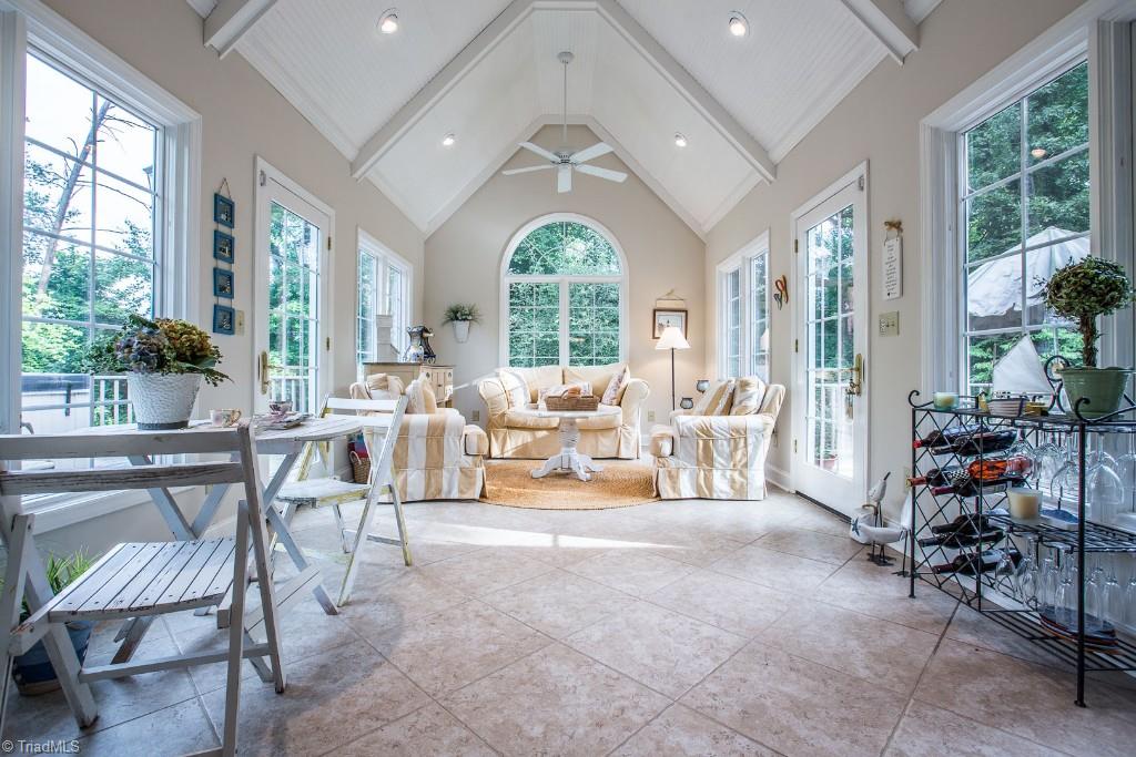 5707 Roundtable Road Greensboro, NC 27407 - Photo 1 of 29 You will never want to leave this sunroom! Feel like you are at the beach everyday! High Bead Board Ceilings, fan, recessed lighting, french doors open to deck on two sides, tile on the diagonal.