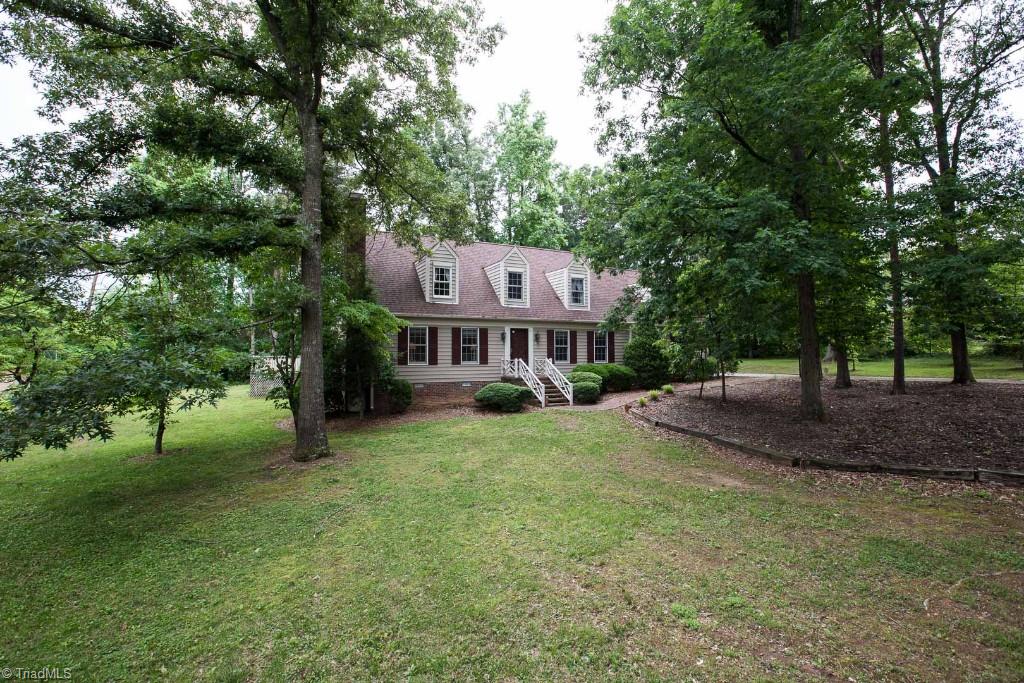 5707 Roundtable Road Greensboro, NC 27407 - Photo 2 of 29 Large .84 acre lot. Low maintenance vinyl siding, newer architectural roof, newer windows. County Taxes!