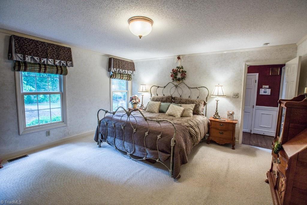 5707 Roundtable Road Greensboro, NC 27407 - Photo 12 of 29 Spacious Master Bedroom on Main. Neutral faux painted walls.