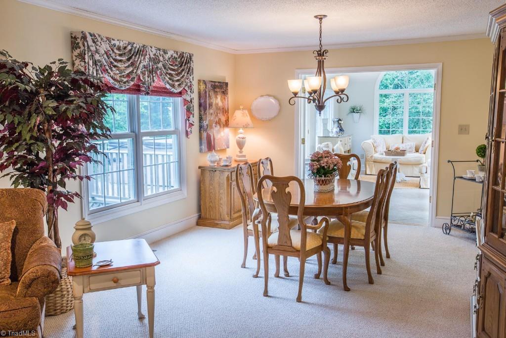 5707 Roundtable Road Greensboro, NC 27407 - Photo 29 of 29 You have plenty of room in Dining Room for Family and Friend gatherings. Love the Open Floor Plan! Pretty lighting.
