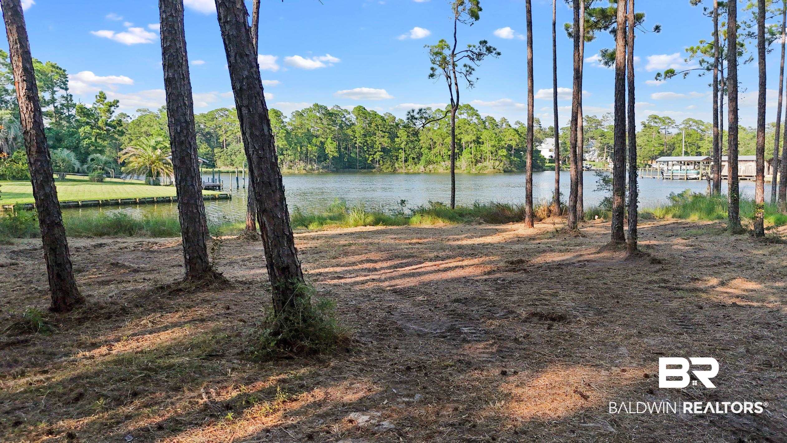 4 South Bayou Drive Elberta, AL 36530 - Photo 7 of 12 View of yard with a water view and a dock