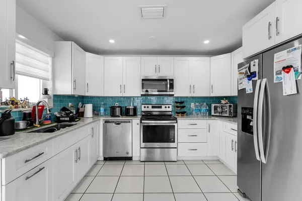 a bathroom with a sink mirror vanity and toilet