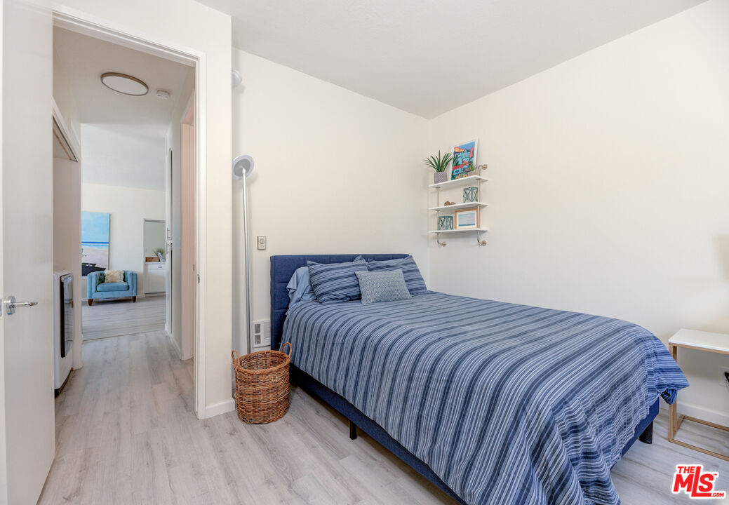 1 Northstar Street, Unit 103 Marina del Rey, CA 90292 - Photo 11 of 18 a bedroom with a bed and view of living room