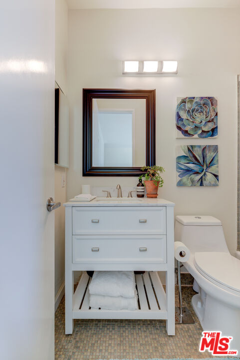 1 Northstar Street, Unit 103 Marina del Rey, CA 90292 - Photo 14 of 18 a bathroom with a sink mirror and toilet