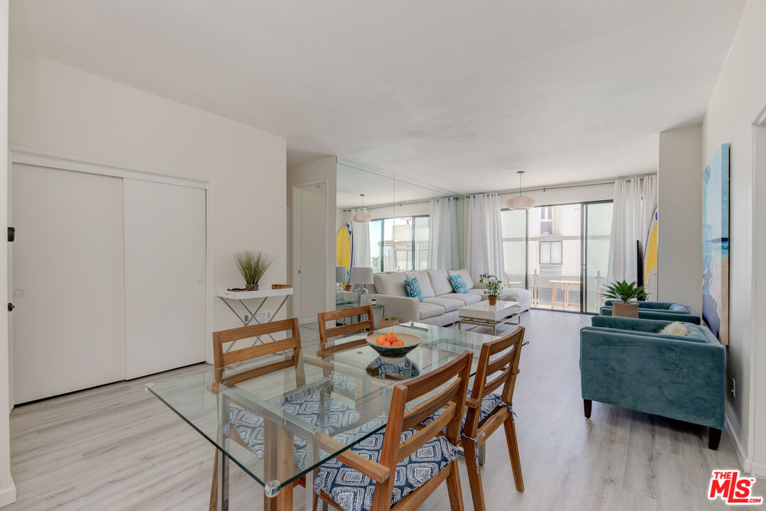 1 Northstar Street, Unit 103 Marina del Rey, CA 90292 - Photo 6 of 18 a dining room with furniture and wooden floor