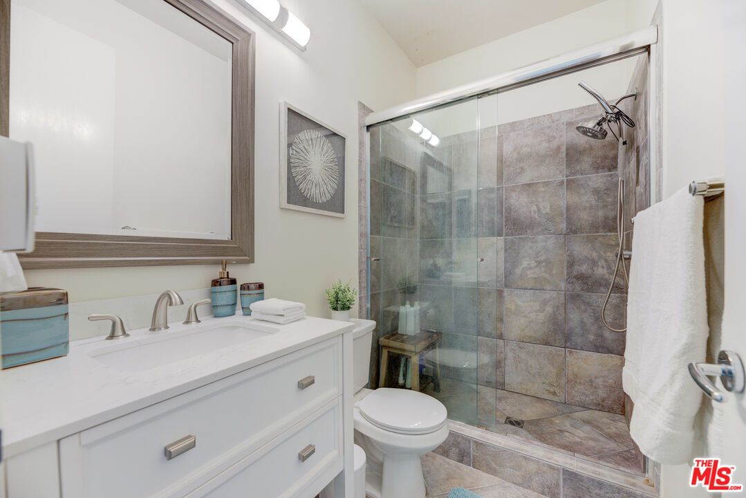 1 Northstar Street, Unit 103 Marina del Rey, CA 90292 - Photo 10 of 18 a bathroom with a sink mirror toilet and shower