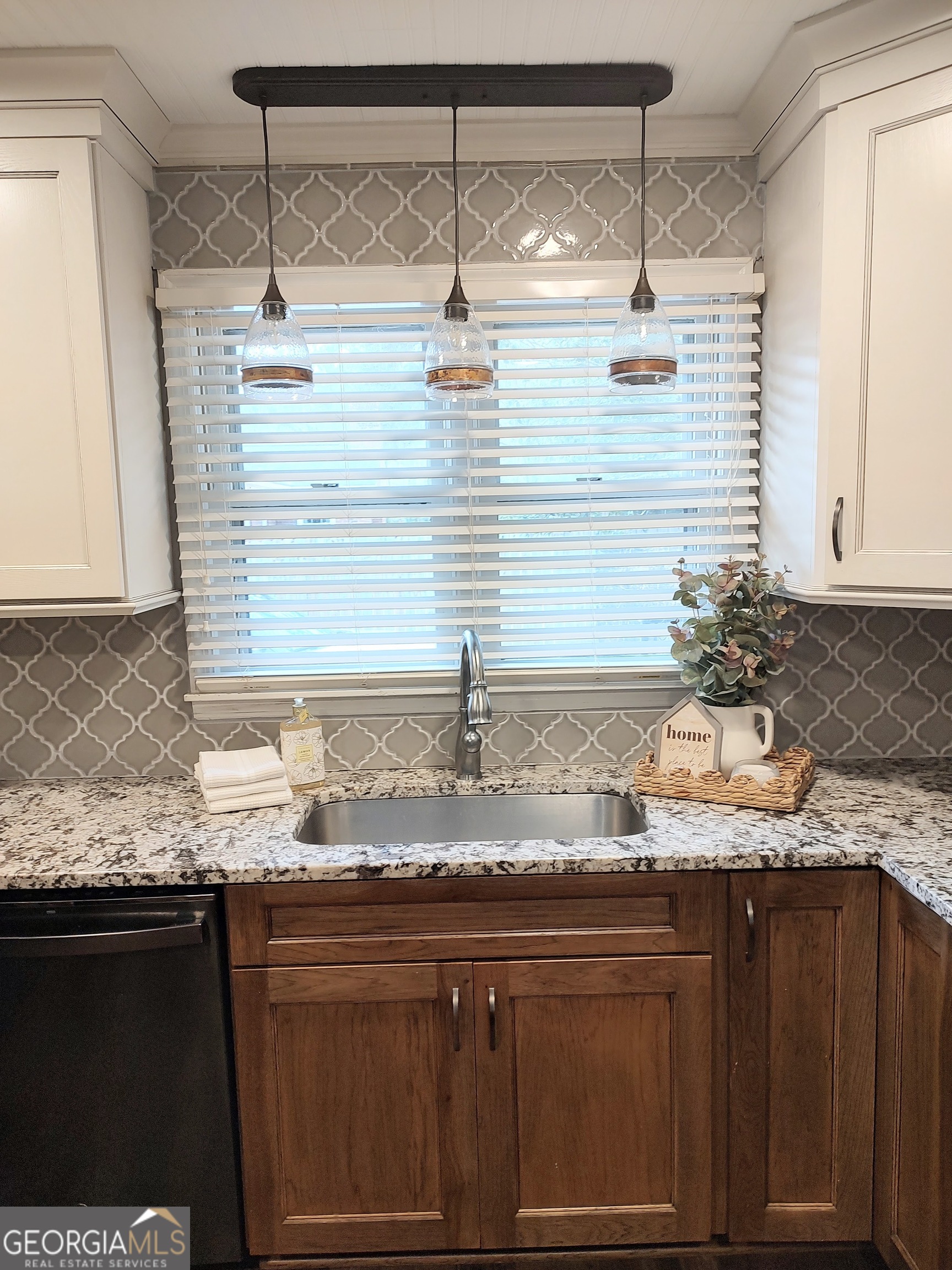 615 Hemlock Drive Thomson, GA 30824 - Photo 11 of 32 a bathroom with a granite countertop sink and a mirror