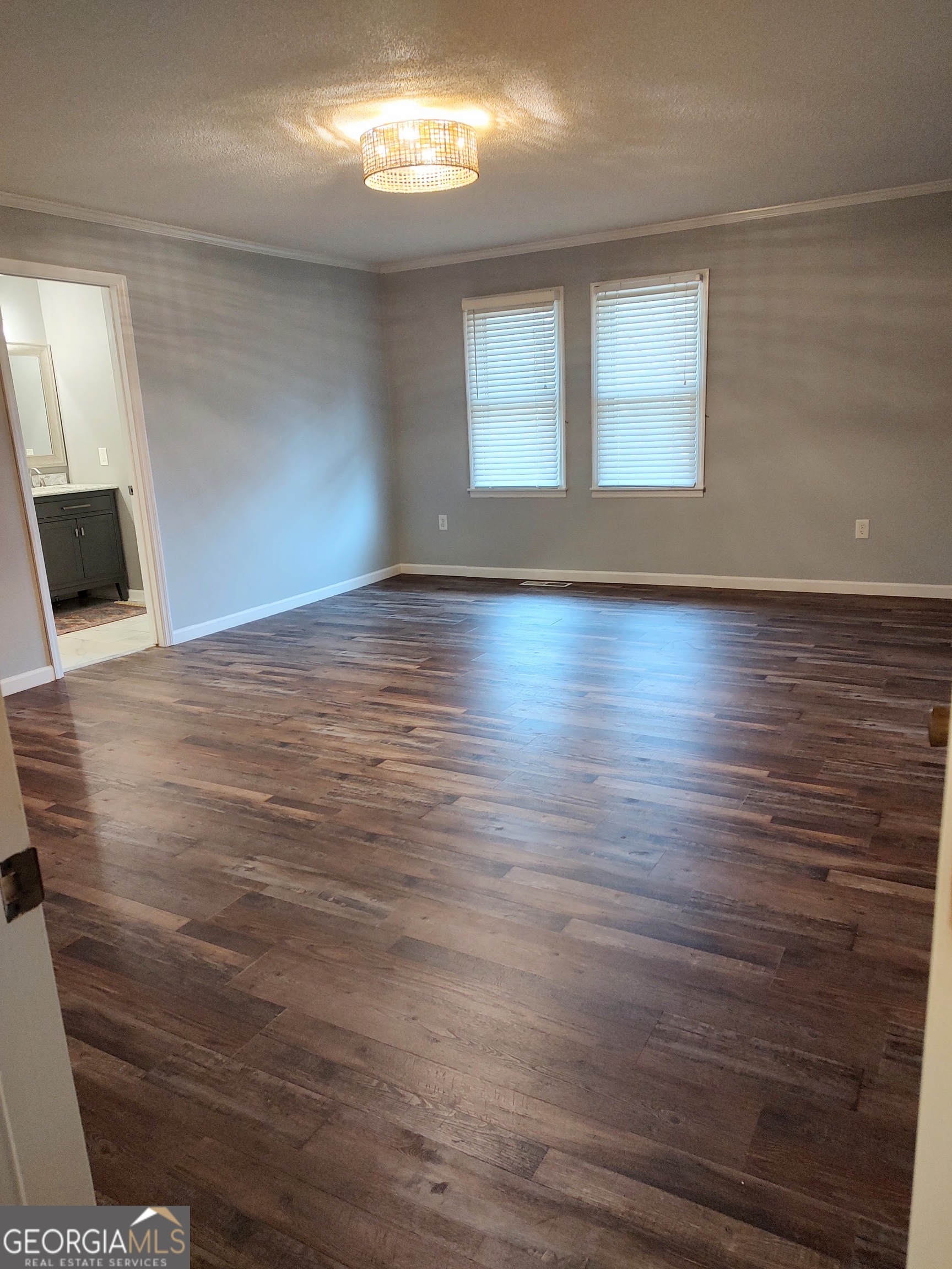615 Hemlock Drive Thomson, GA 30824 - Photo 15 of 32 wooden floor in an empty room with a window