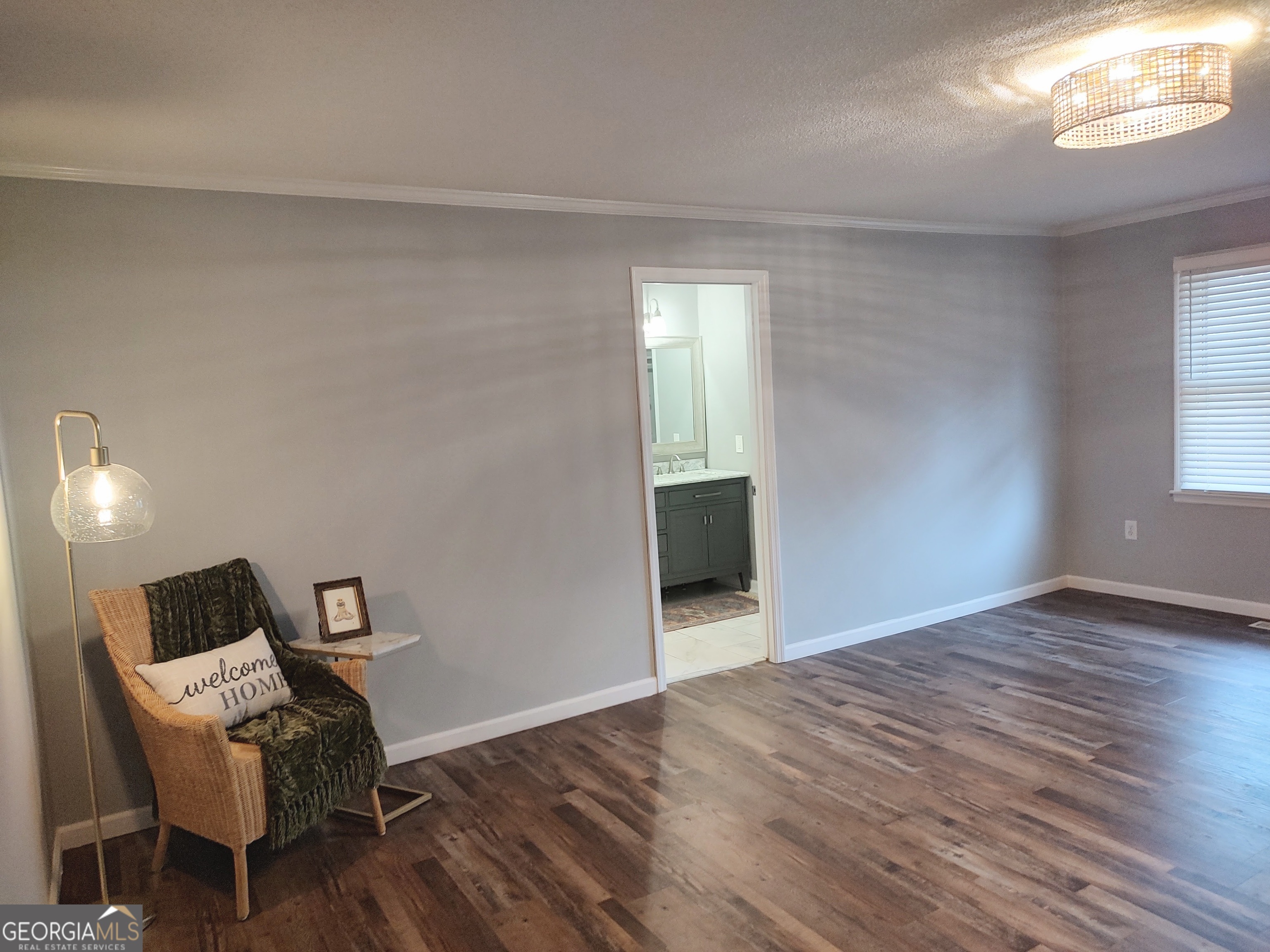 615 Hemlock Drive Thomson, GA 30824 - Photo 16 of 32 a view of a livingroom with a chair and a window