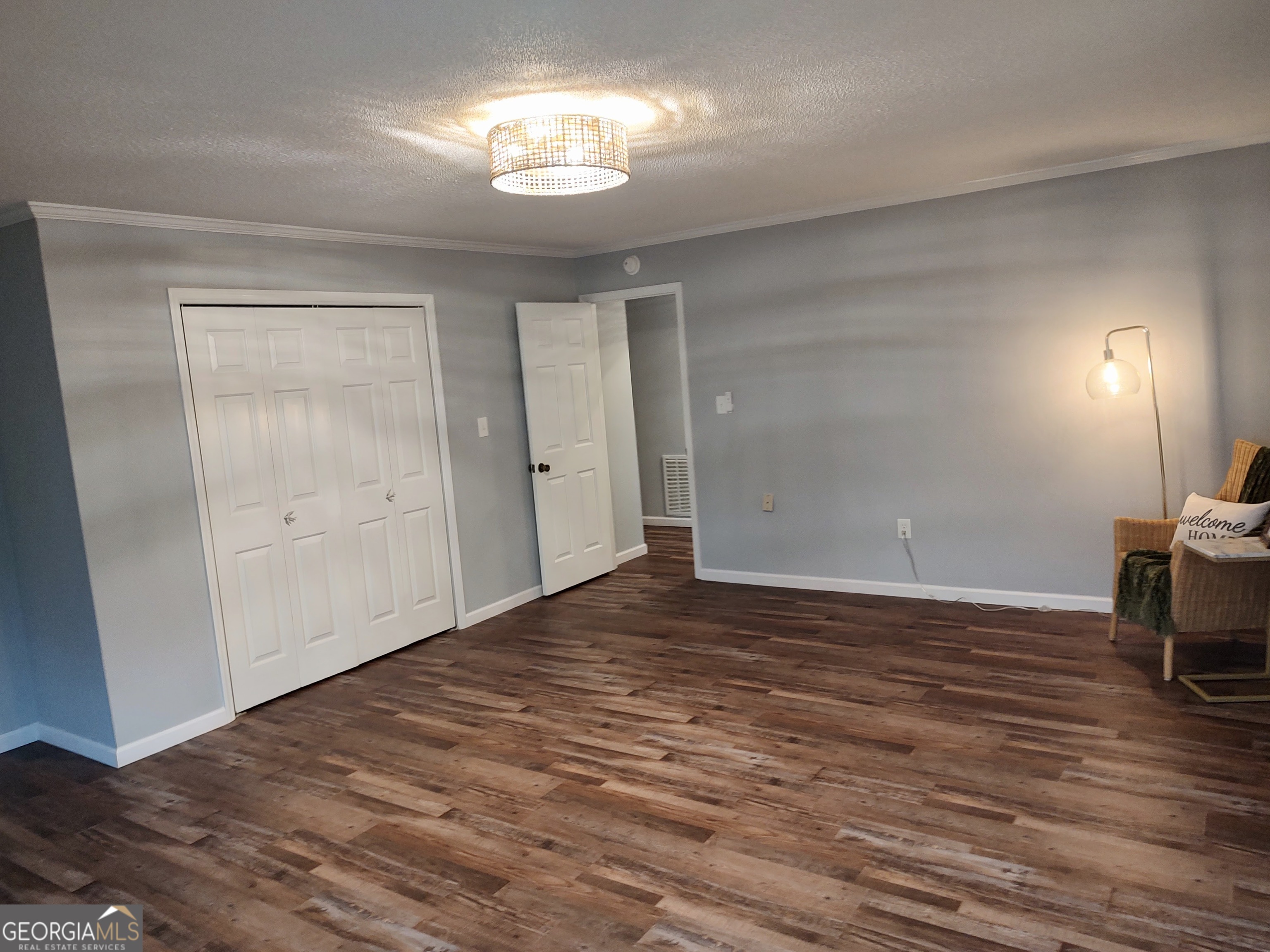 615 Hemlock Drive Thomson, GA 30824 - Photo 18 of 32 a view of empty room with wooden floor and fan