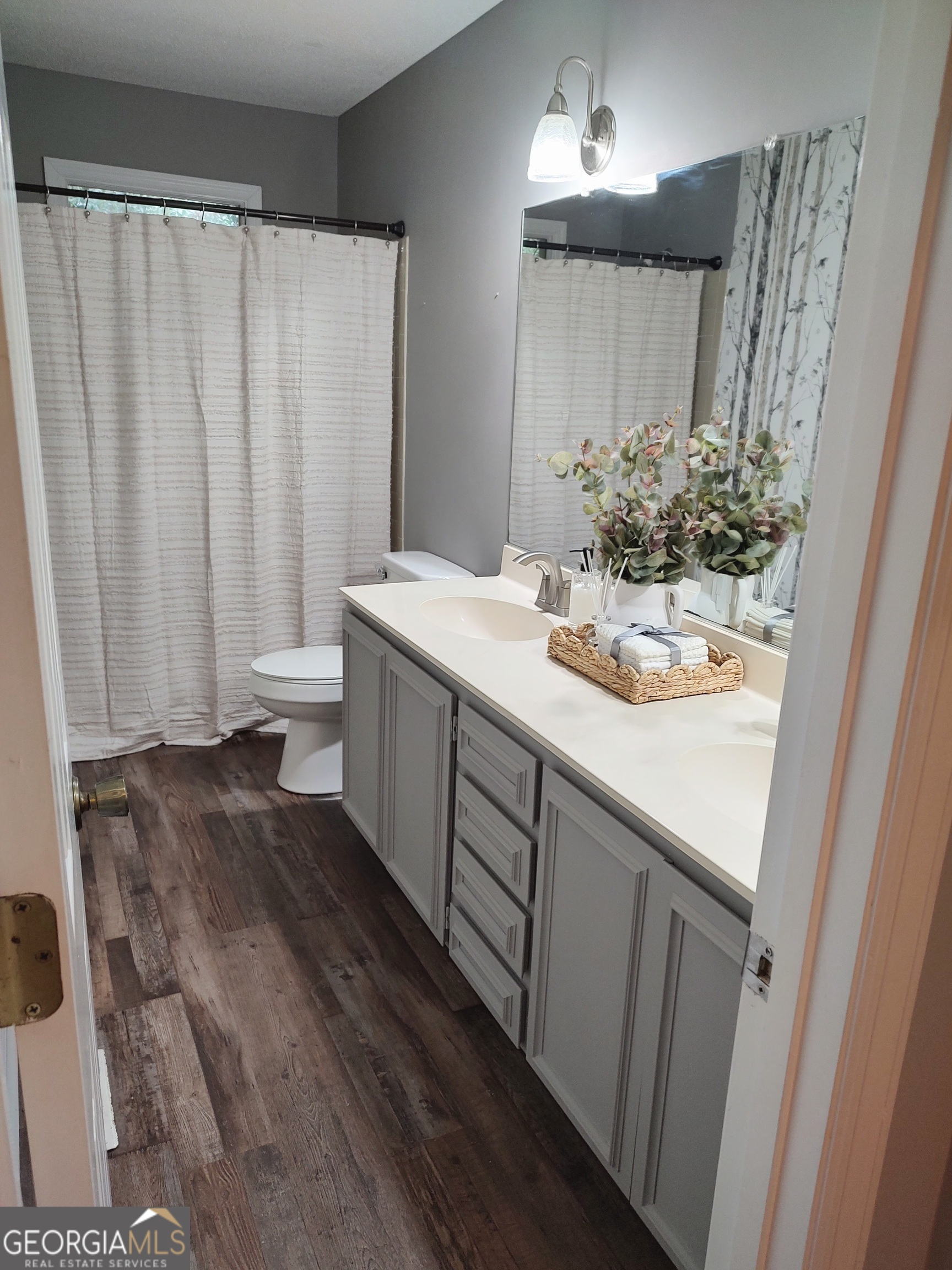 615 Hemlock Drive Thomson, GA 30824 - Photo 24 of 32 a bathroom with a sink and a mirror
