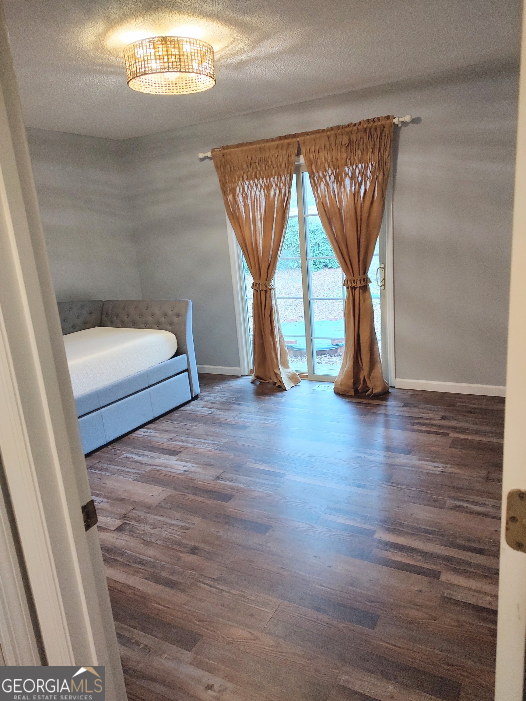 615 Hemlock Drive Thomson, GA 30824 - Photo 27 of 32 a view of empty room with wooden floor and fan