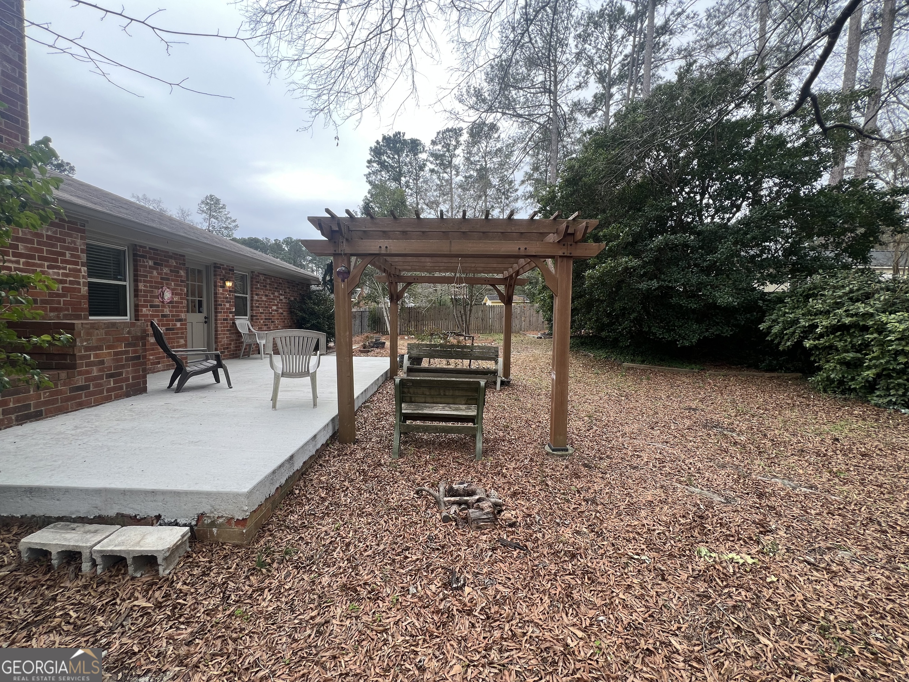 615 Hemlock Drive Thomson, GA 30824 - Photo 29 of 32 a view of a chairs and table in backyard