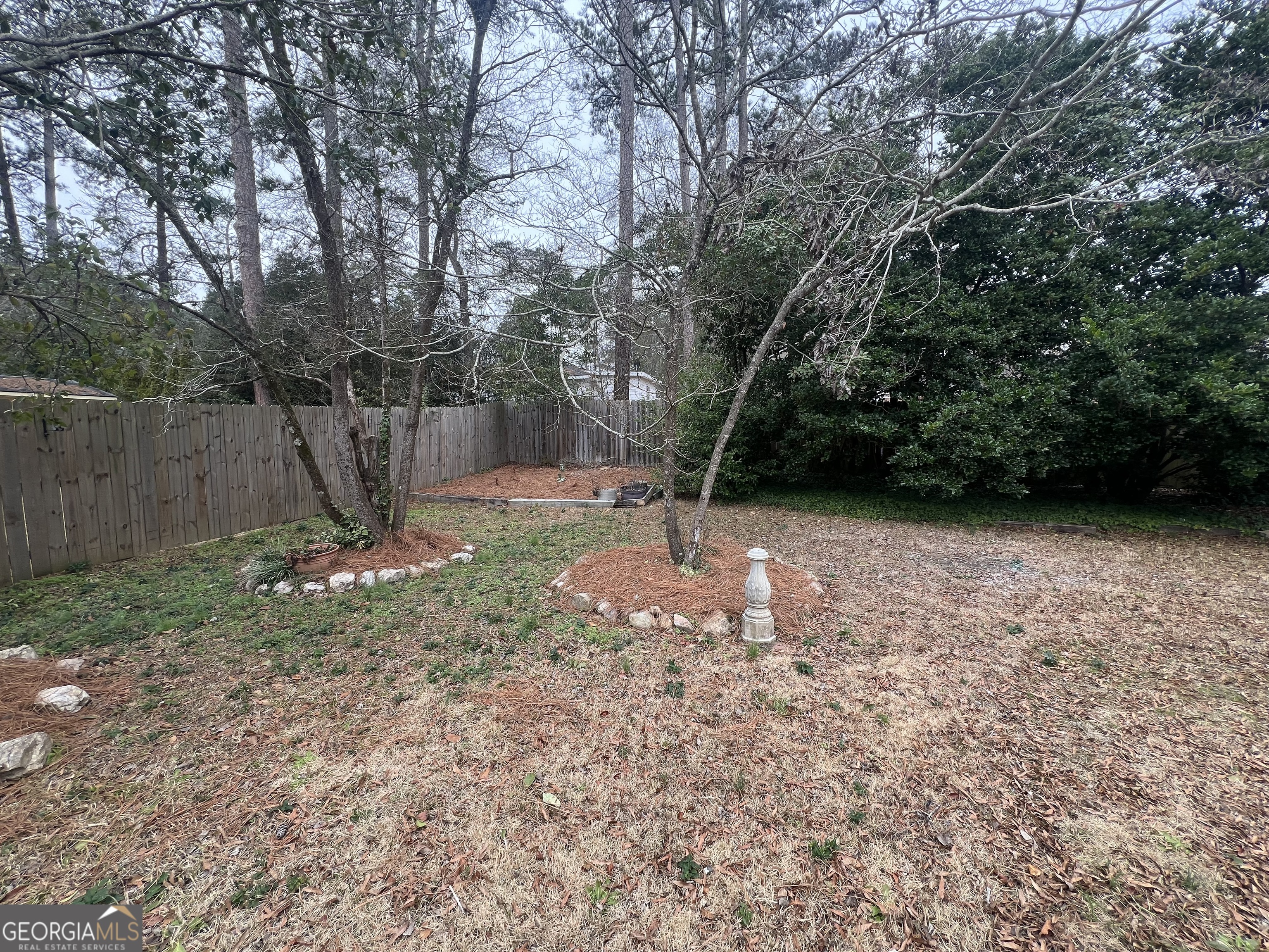 615 Hemlock Drive Thomson, GA 30824 - Photo 32 of 32 a backyard of a house with lots of green space