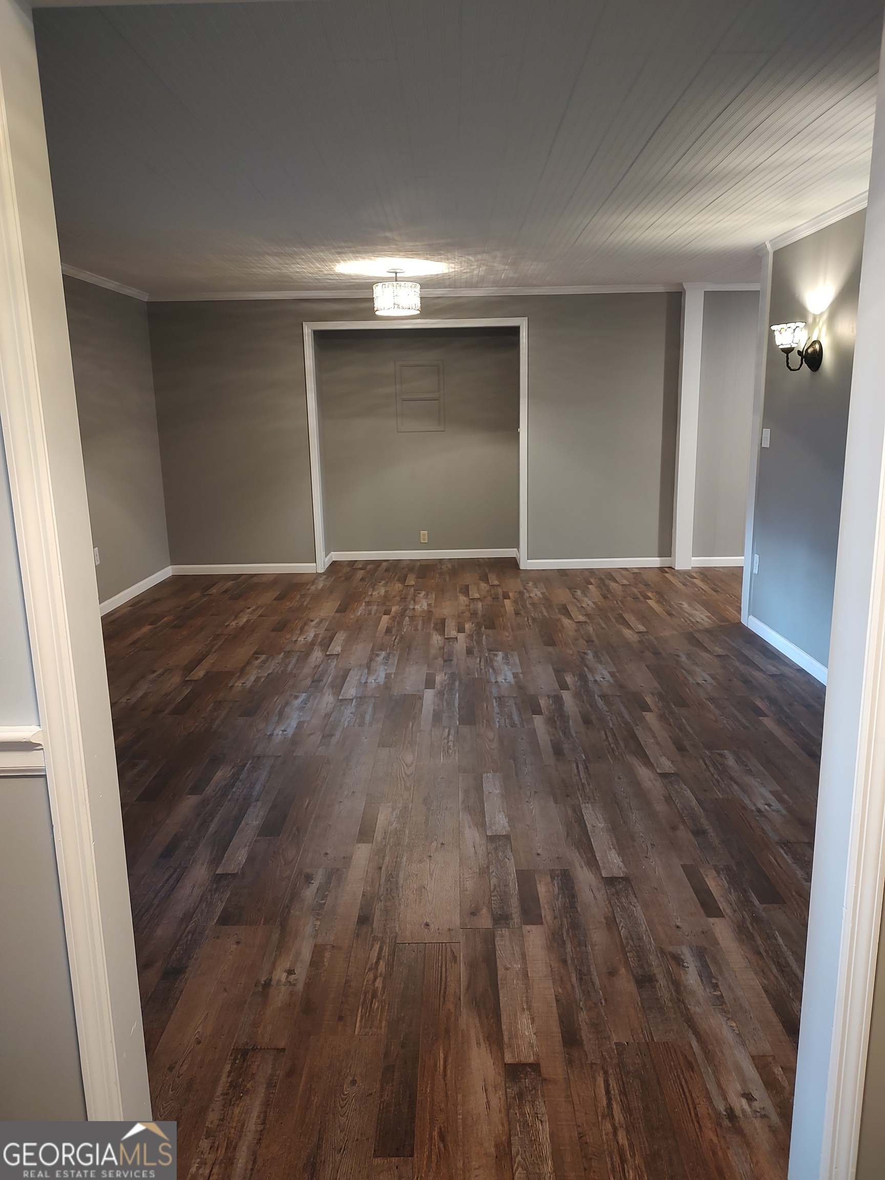 615 Hemlock Drive Thomson, GA 30824 - Photo 5 of 32 a view of an empty room and wooden floor