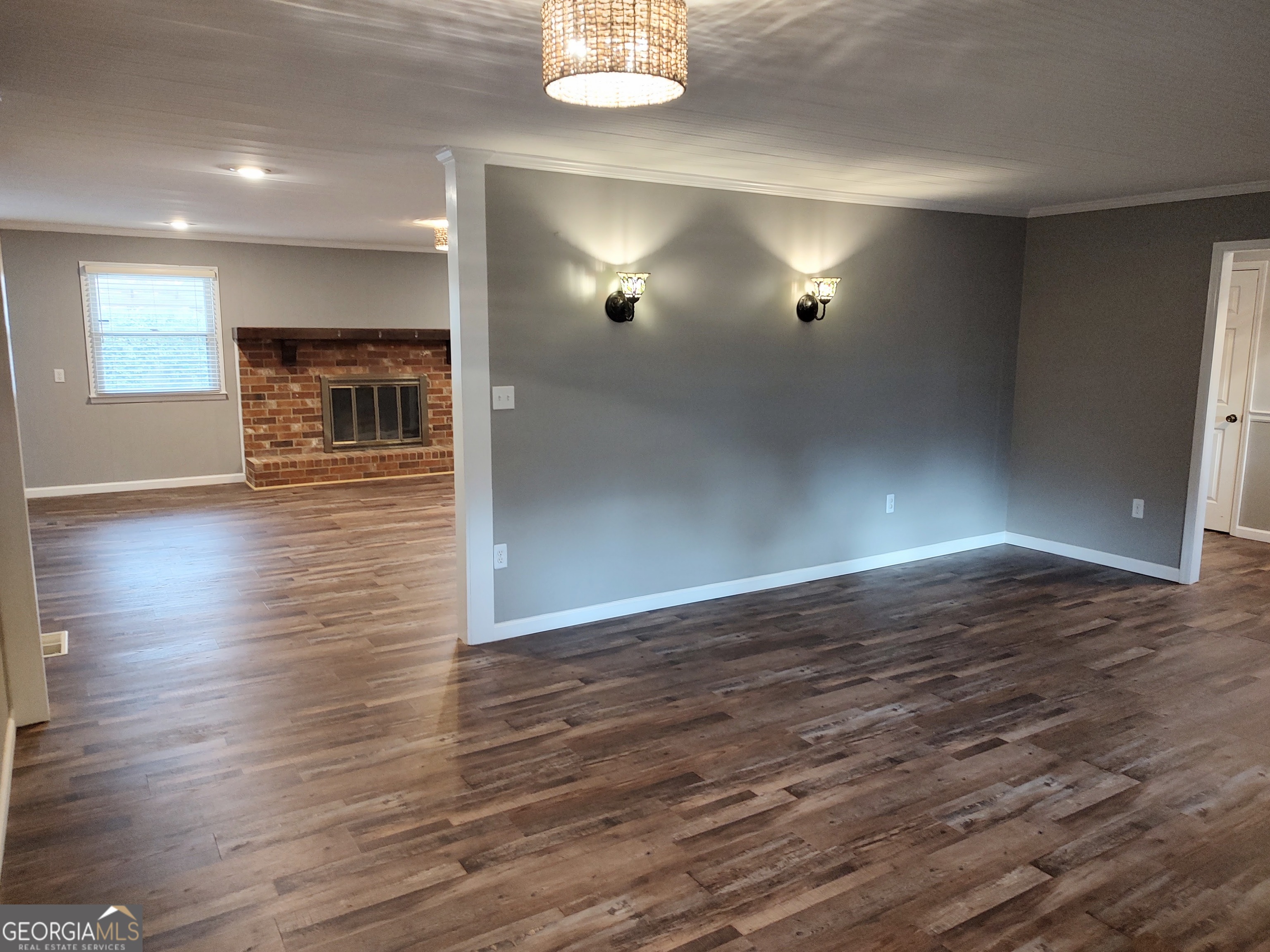 615 Hemlock Drive Thomson, GA 30824 - Photo 6 of 32 an empty room with wooden floor and windows