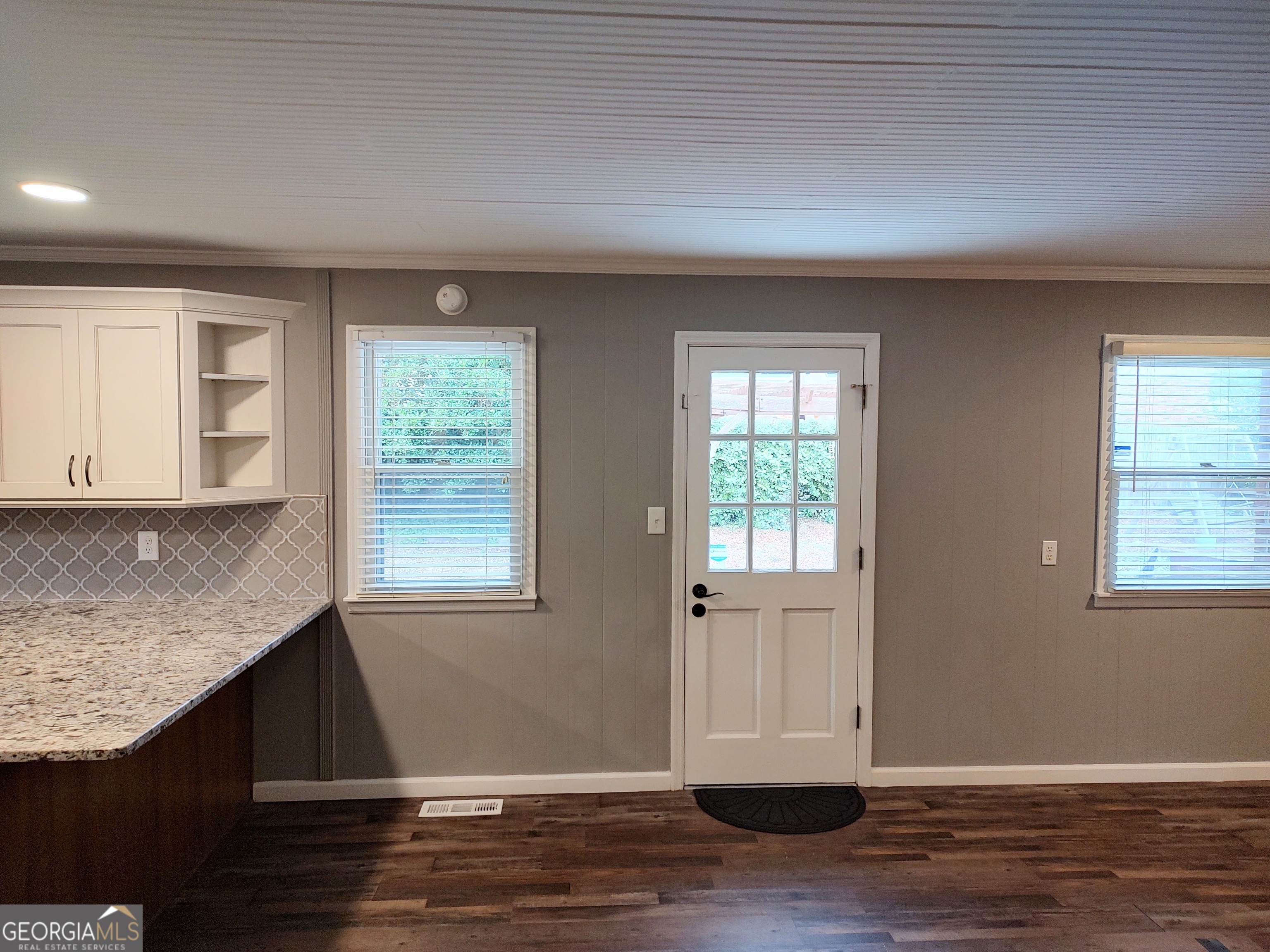 615 Hemlock Drive Thomson, GA 30824 - Photo 9 of 32 an empty room with wooden floor and windows