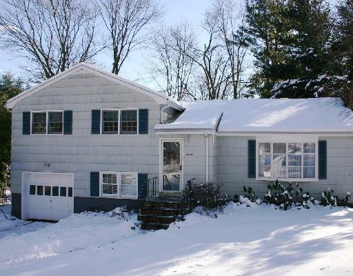 7 Ambler Road Westport, CT 06880 - Photo 1 of 1 a front view of a house with a yard
