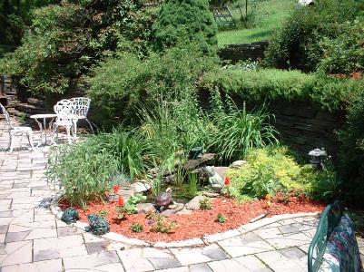 7525 Hahn Road Bangor, PA 18013 - Photo 5 of 10 a view of a garden with flowers and trees