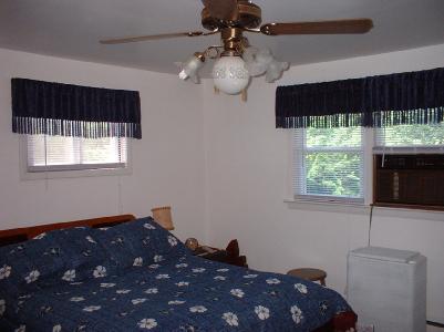 7525 Hahn Road Bangor, PA 18013 - Photo 10 of 10 a bedroom with a bed window and wall painting